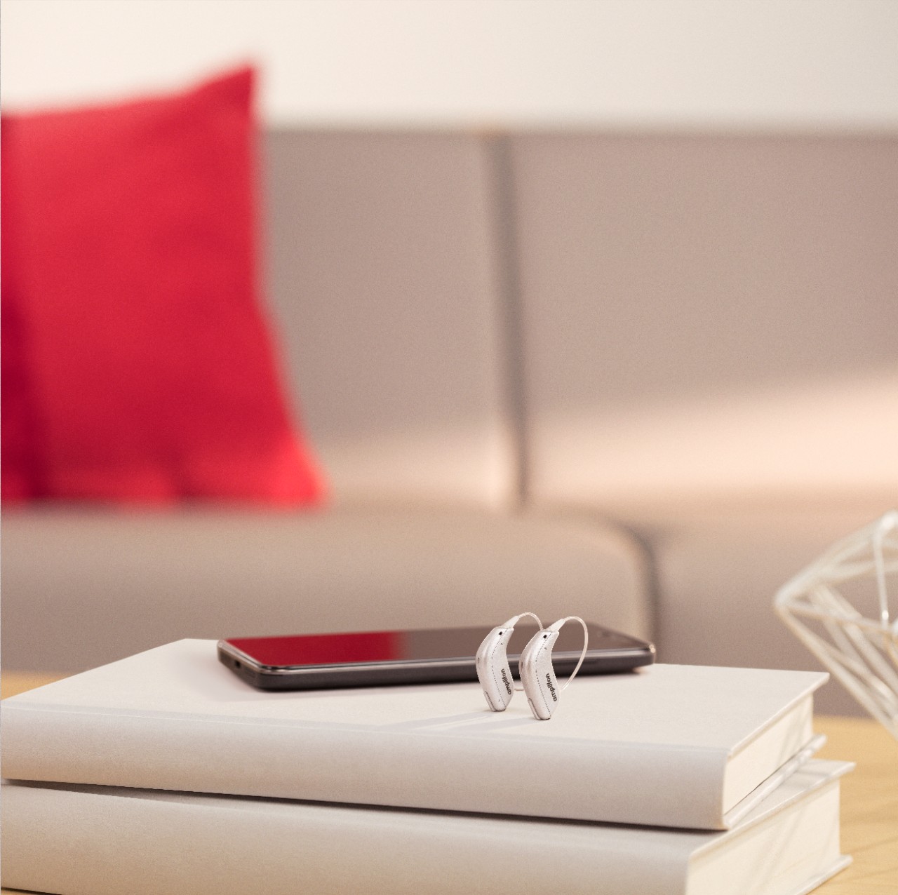 Amplifon Rechargeable Hearing Aids in their charger